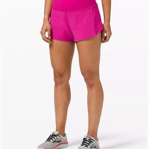 Never worn. Lululemon. Speed Up Mid-Rise Lined Short 4". Ripened Raspberry